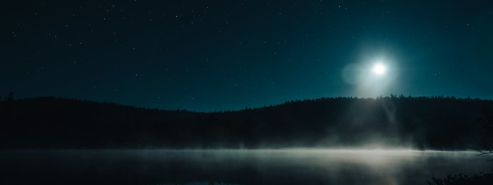 Moonlight reflecting over serene calm water